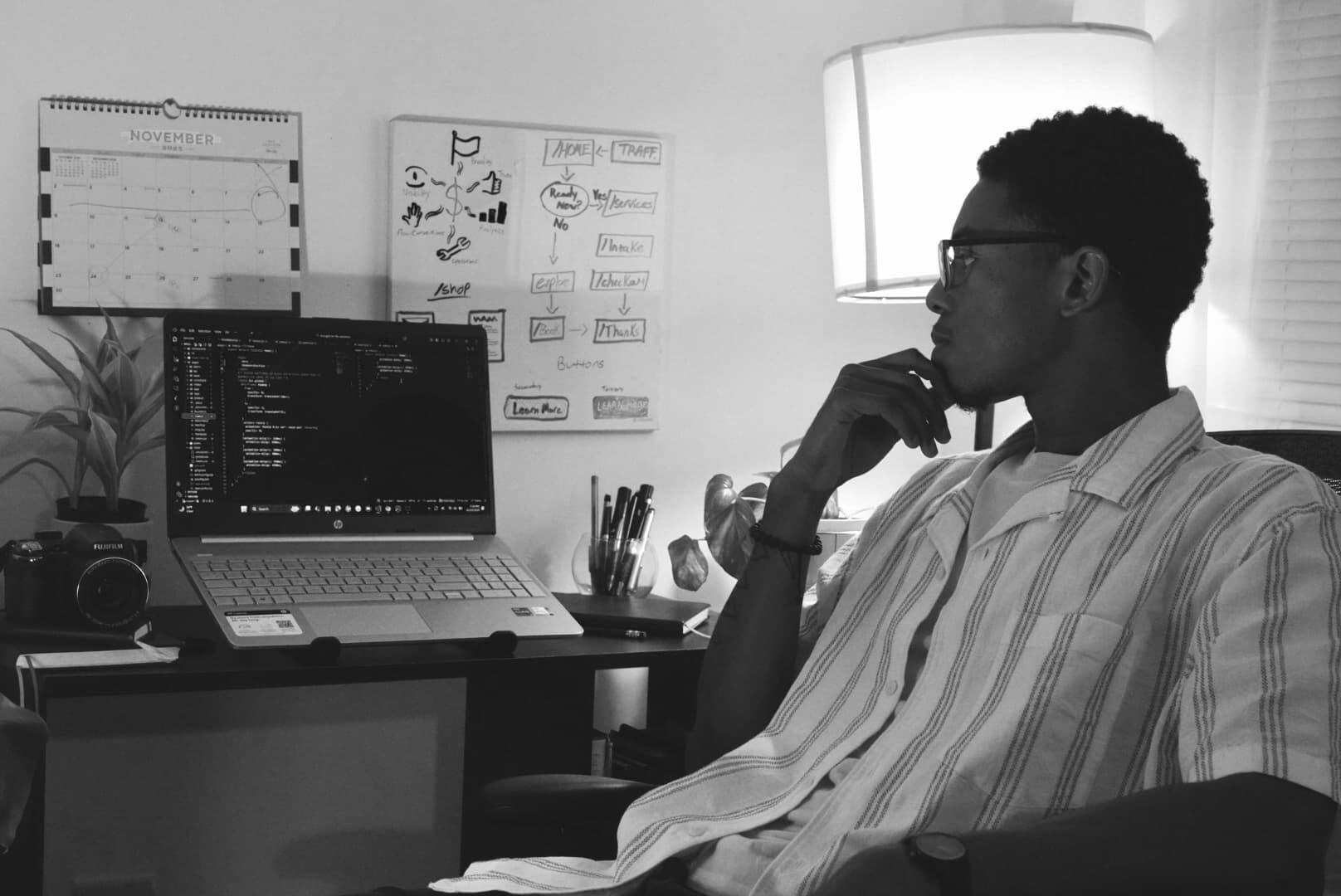 Founder portrait in a calm, editorial workspace.